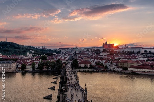 Photography Aerial shot of the Charles Bridge at sunset in Prague, Czech Republic