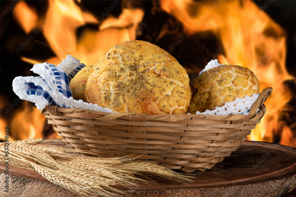 Rustic bread in basket with fire background