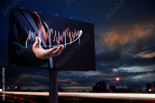 Businessman hand show business growth investment stock finance profit graph of marketing financial increase digital money trade chart advertise on billboard blank for outdoor advertising poster.