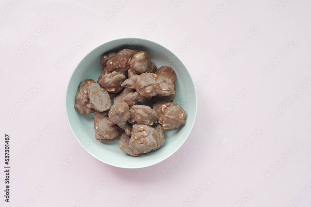 peanut chocolate candy on light color background peanut chocolate candy on light color background