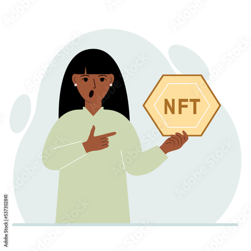 NFT concept. The woman is holding nft in his hand. Works of art using non-fungible tokens for auctions, sale and purchase of works of art.