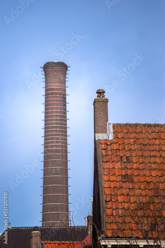View of district heating plant and houses in old town of Leiden, Netherlands photo