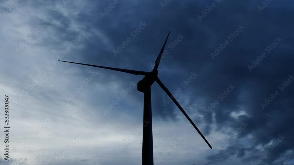 Wind turbine farm with rays of light at sunset. Wind turbine farm with rays of light at sunset.
