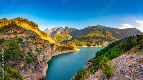 Beautiful picturesque landscape of the nature of a mountainous region with a gorge in which a lake is spread. © Laura Pashkevich