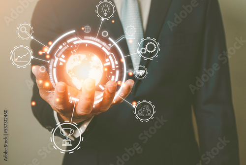 Businessman Hand holding virtual Global Internet connection metaverse. Business global internet connection application technology and digital marketing, Financial and banking, Digital link tech 