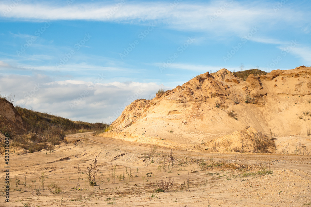 sand quarry, in the photo, a quarry for the extraction of sand against a blue sky sand quarry, in the photo, a quarry for the extraction of sand against a blue sky