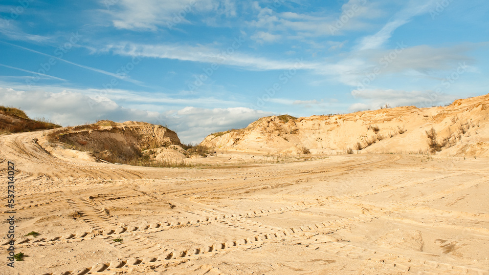 sand quarry, in the photo, a quarry for the extraction of sand against a blue sky sand quarry, in the photo, a quarry for the extraction of sand against a blue sky