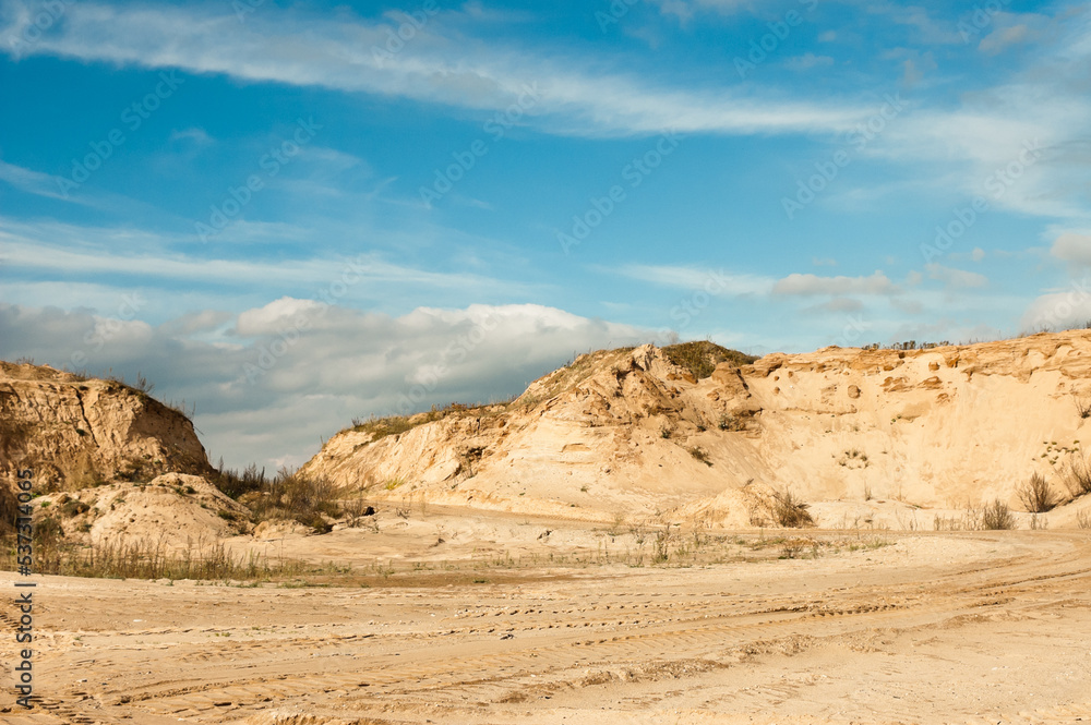 sand quarry, in the photo, a quarry for the extraction of sand against a blue sky sand quarry, in the photo, a quarry for the extraction of sand against a blue sky