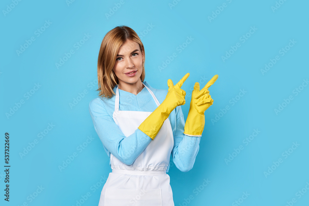 woman in gloves pointing fingers at copyspace woman in gloves pointing fingers at copyspace