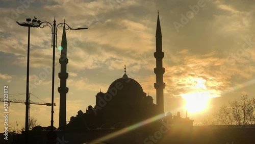 Silhouette of the new mosque in istanbul. New mosque in the morning sun. The sun rises over the mosque, istanbul photo