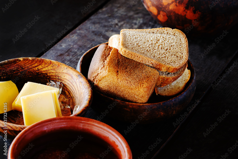 Medieval Rye Rye bread in earthenware. Table setting in medieval style ...