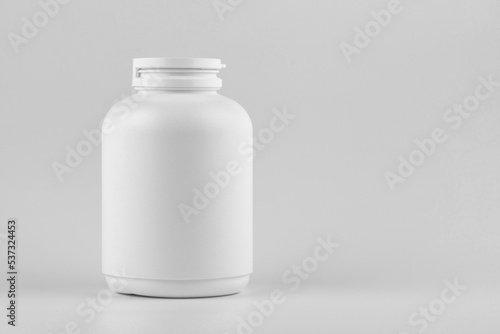 Skincare and cosmetology or medical bottle mockup with copy space. Unbranded white plastic flacon for cosmetics products or pills. Branding identity template for text and design
