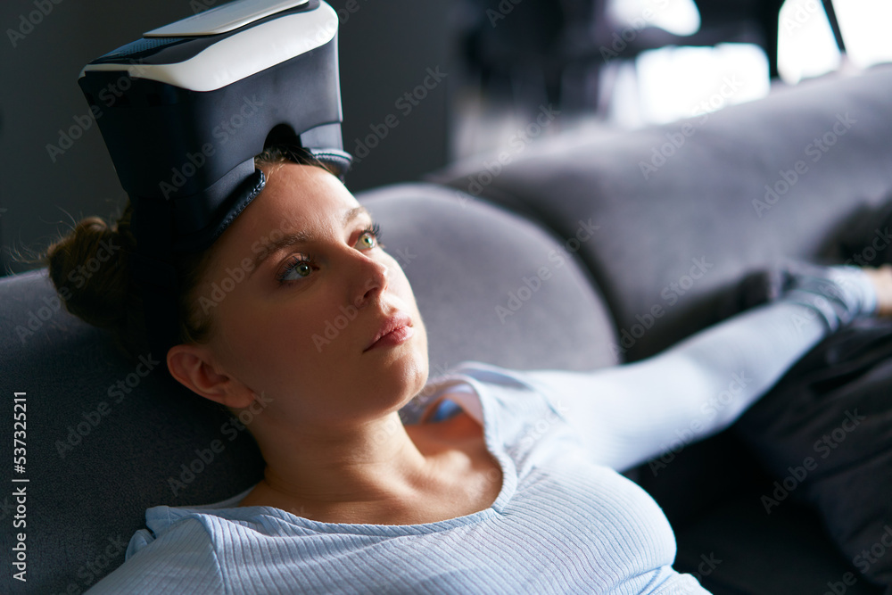 Robot like futuristic doll woman in virtual reality goggles interface