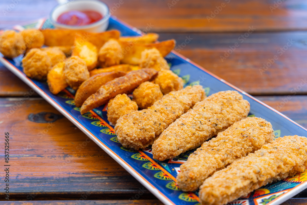 Fry fish finger and potato wedges Fry fish finger and potato wedges