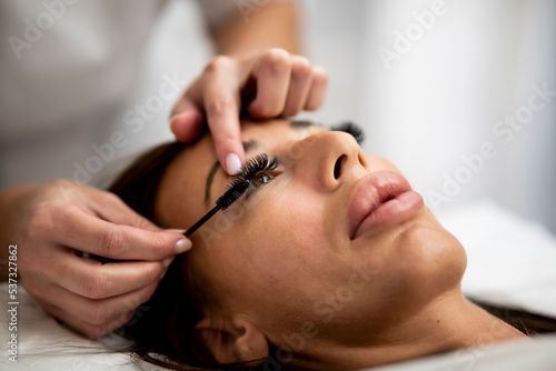 Woman Eye with Long Eyelashes. Beautiful Young Woman During Eyelash Extension.