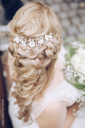 beautiful bridal hairstyle photographed from above. long blond hair with slight curls