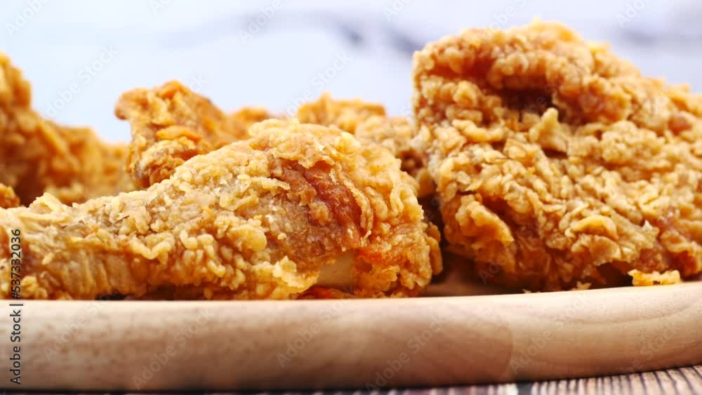 Crispy fried chicken wings on a plate top view . Crispy fried chicken wings on a plate top view .