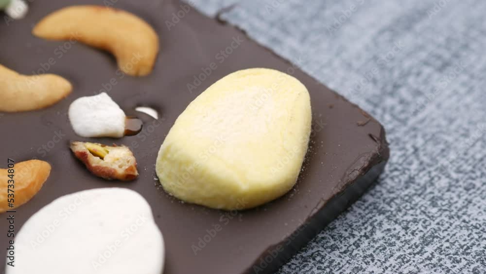 Nut candy in white chocolate on white backgorund Nut candy in white chocolate on white backgorund