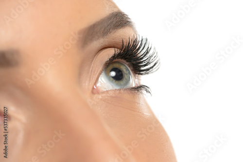 Fototapeta Naklejka Na Ścianę i Meble -  Beauty female eye with curl long false eyelashes on a white background