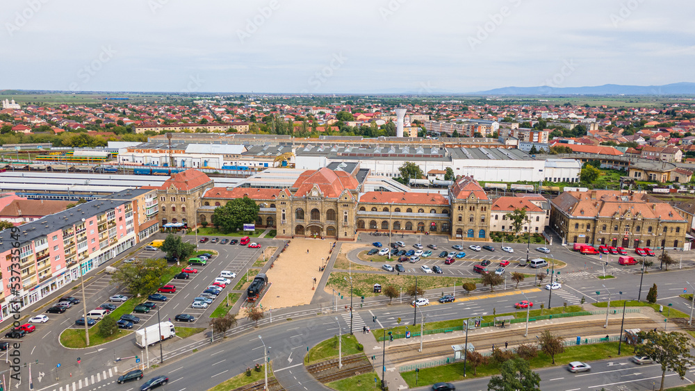 Aerial photography of the train station in Arad city, Romania. Photography was taken from a drone at a lower altitude capturing the train station building.