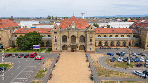 Aerial photography of the train station in Arad city, Romania. Photography was taken from a drone at a lower altitude capturing the train station building. photo