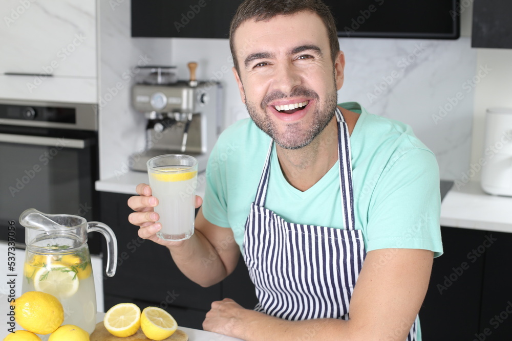 Man preparing a fresh lemonade at home Man preparing a fresh lemonade at home