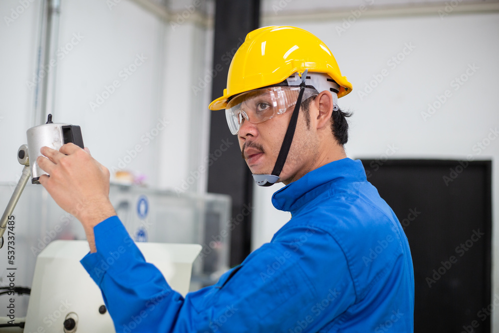 experienced operator technician worker or engineer metalworker industrial in safety helmet working or repair on metal machine, professional maintenance skill man in industry manufacturing. men at work experienced operator technician worker or engineer metalworker industrial in safety helmet working or repair on metal machine, professional maintenance skill man in industry manufacturing. men at work