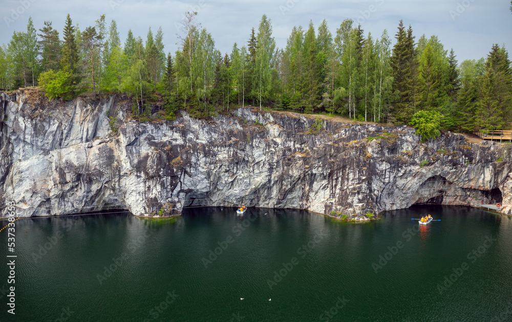 Tourists in boat sailing the former marble quarry, Karelia