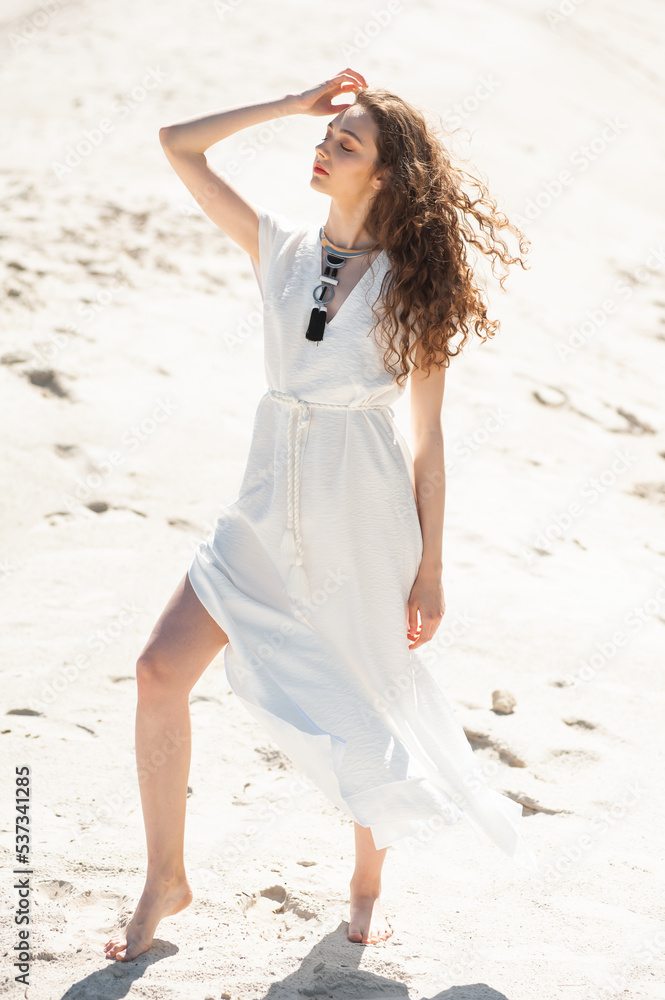 Happy young woman on tropical resort. Fashion style woman. Concept of enjoying weekend, vacation Happy young woman on tropical resort. Fashion style woman. Concept of enjoying weekend, vacation