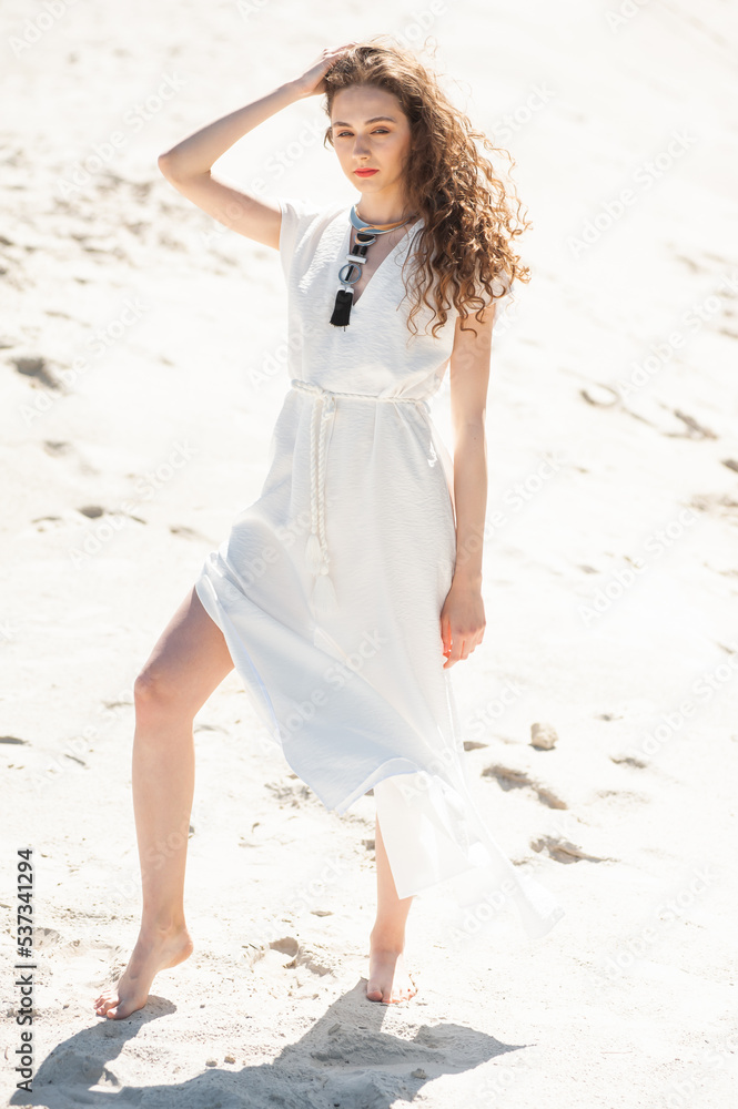 Happy young woman on tropical resort. Fashion style woman. Concept of enjoying weekend, vacation Happy young woman on tropical resort. Fashion style woman. Concept of enjoying weekend, vacation