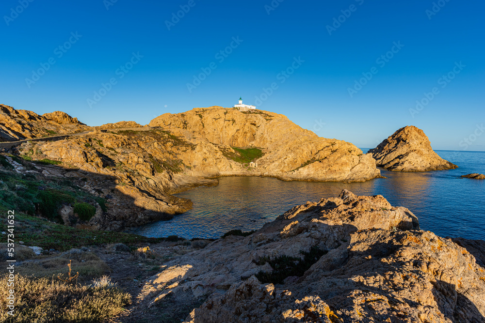 The old lighthouse on the rocky Pietra peninsula in the L'Ile-Rousse commune of France on Corsica, France 