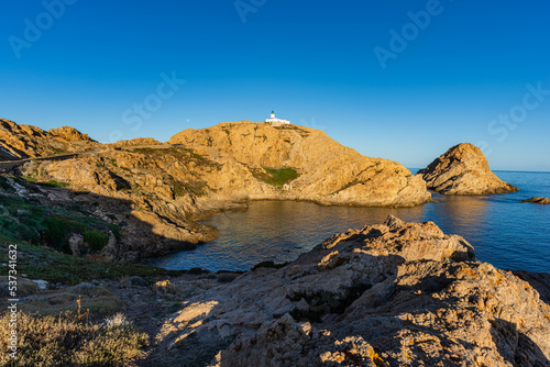 The old lighthouse on the rocky Pietra peninsula in the L'Ile-Rousse commune of France on Corsica, France 