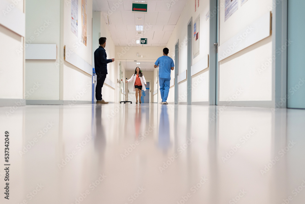 Fototapeta premium People standing in hospital hall