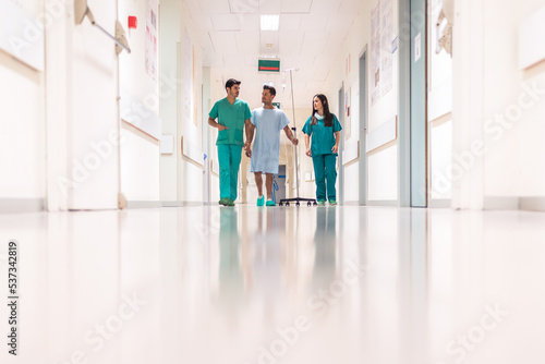 Medics and patient in hall