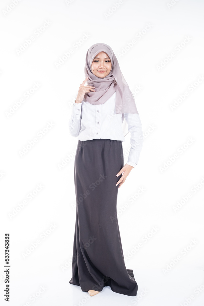 Portrait of Muslim woman in office attire and wearing a hijab. Asian woman in a corporate world. Formal corporate outfit and elegant appearance. Corporate or business people concept. Isolated