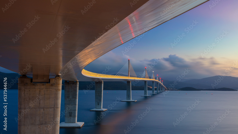Peljesac Bridge, Croatia. Panoramic image of beautiful modern multi-span cable-stayed Peljesac Bridge over the sea in Dubrovnik-Neretva County, Croatia at sunset.
