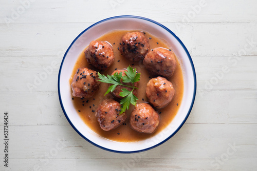 Tapa of beef meatballs with red wine sauce. Traditional Spanish recipe.