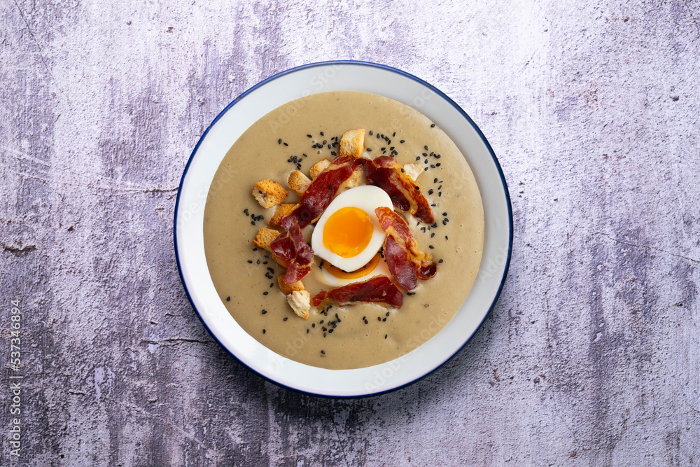 Smoked aubergine cream with crispy Iberian ham and boiled egg. Smoked aubergine cream with crispy Iberian ham and boiled egg.
