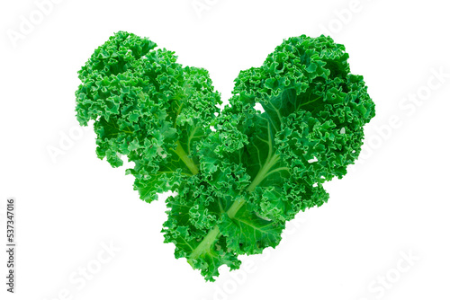 Closeup of some leaves of kale forming a heart on a white background