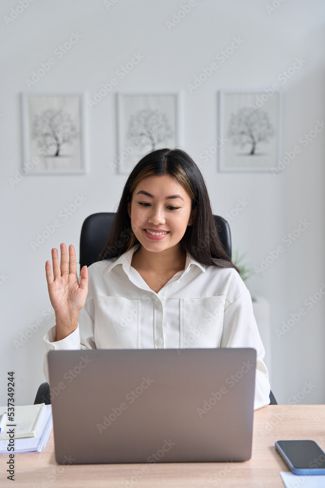 Young smiling asian student freelancer woman using laptop for remote work Young smiling asian student freelancer woman using laptop for remote work
