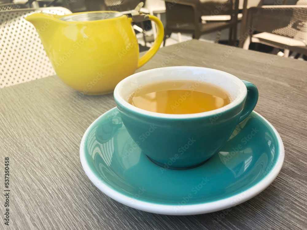 green tea in a cup in a restaurant on the veranda