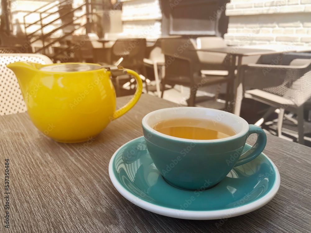 green tea in a cup in a restaurant on the veranda green tea in a cup in a restaurant on the veranda