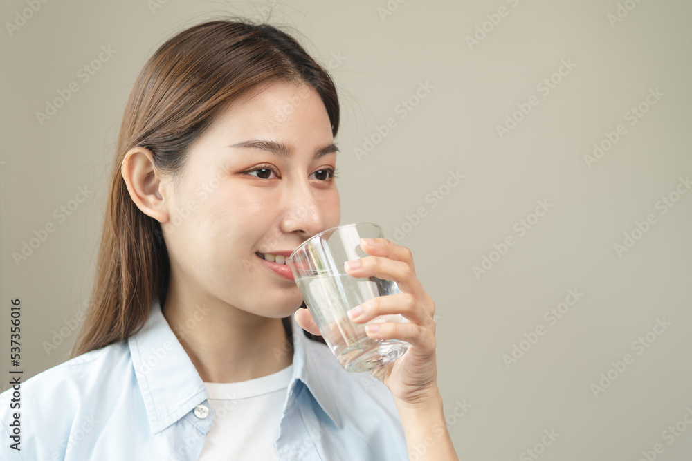 Clean freshwater concept. Woman drink mineral water in the morning for good health. Clean freshwater concept. Woman drink mineral water in the morning for good health.