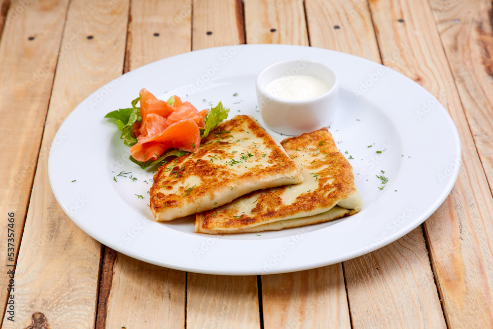 stuffed pancake with cheese and salmon