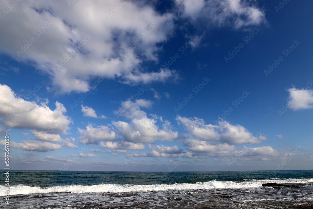 Large rain clouds in the sky over the sea.