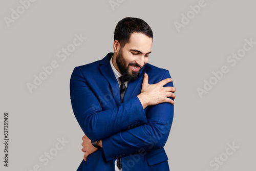 Принти на полотні I am egoist, love myself! Portrait of selfish narcissistic bearded man embracing himself and smiling with dreamy satisfied expression