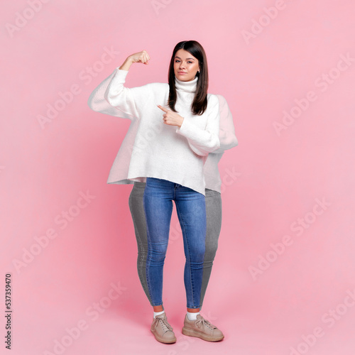 Fotografie Full length portrait of happy woman before and after loosing her weight, pointing at biceps, lose weight through exercise and nutrition