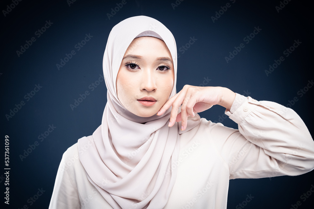 Close up portrait of Muslim woman in office attire and wearing a hijab. Asian woman in a corporate world. Formal corporate outfit and elegant appearance. Corporate or business people concept. Isolated Close up portrait of Muslim woman in office attire and wearing a hijab. Asian woman in a corporate world. Formal corporate outfit and elegant appearance. Corporate or business people concept. Isolated