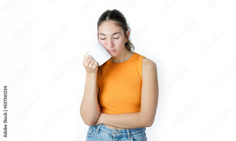 Young tired woman with a coffee mug. Exhausted worker/student. Isolated on white background. Young tired woman with a coffee mug. Exhausted worker/student. Isolated on white background.