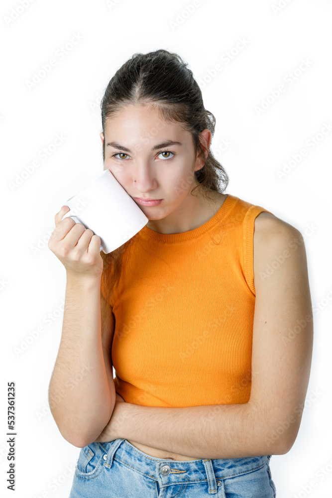 Young tired woman with a coffee mug. Exhausted worker/student. Isolated on white background. Young tired woman with a coffee mug. Exhausted worker/student. Isolated on white background.